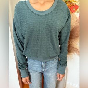 Preowned, Women’s Reversible Long sleeve Nike Athletic Top finger sleevesSize XS